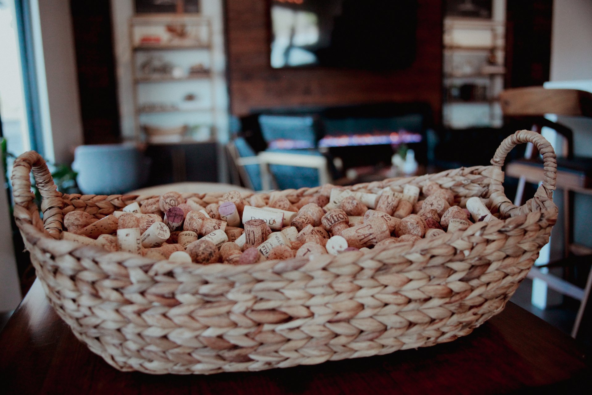 A woven basket filled with wine corks