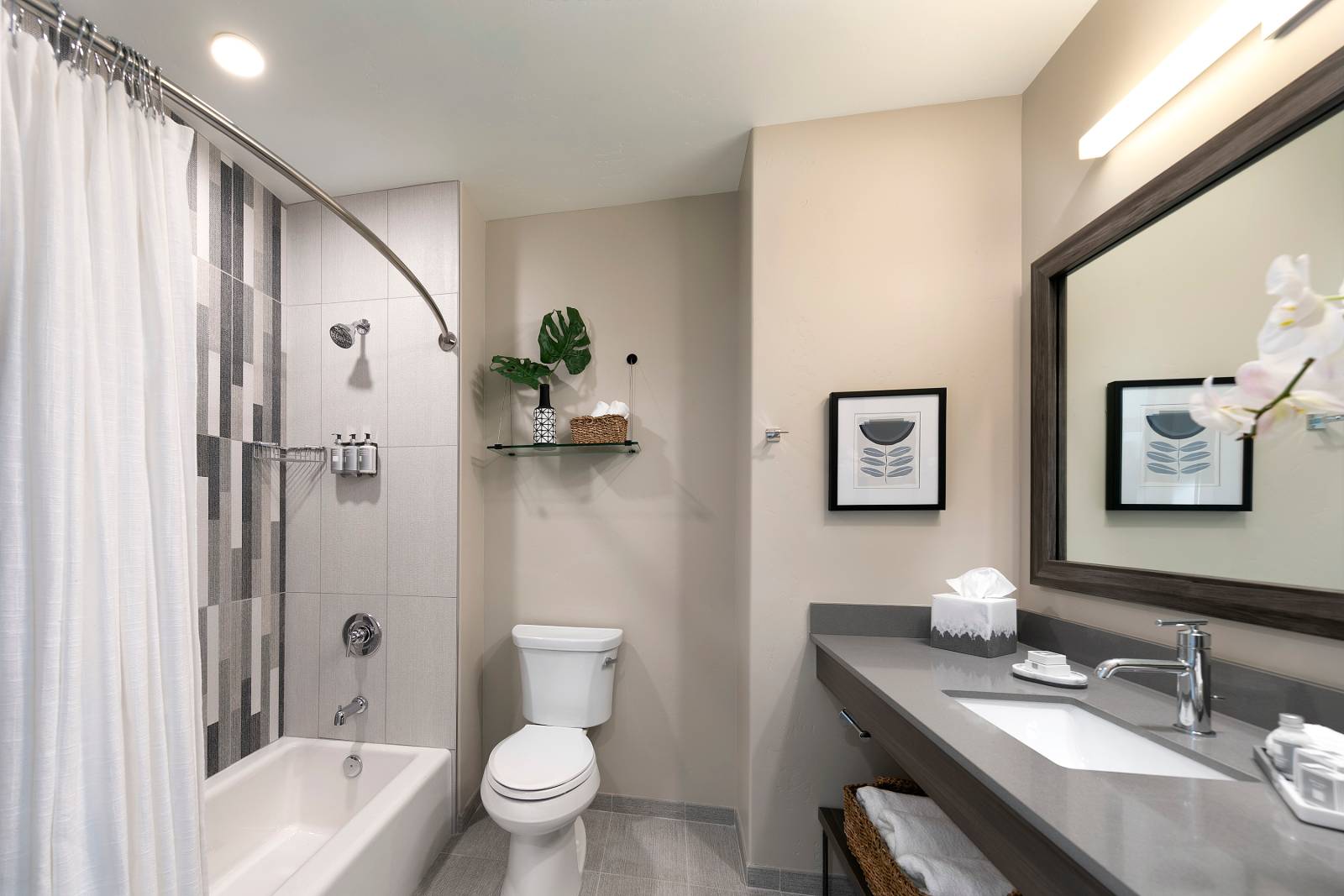 Deluxe Double Queen bathroom with a bath and shower