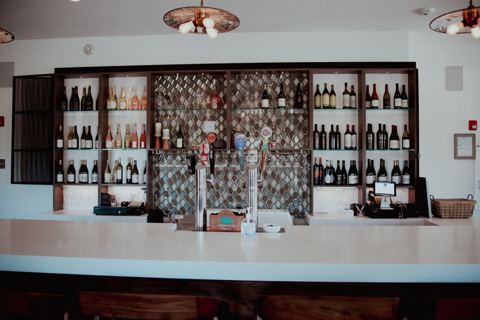 The Vintage Room bar, with bottles on shelves behind the counter
